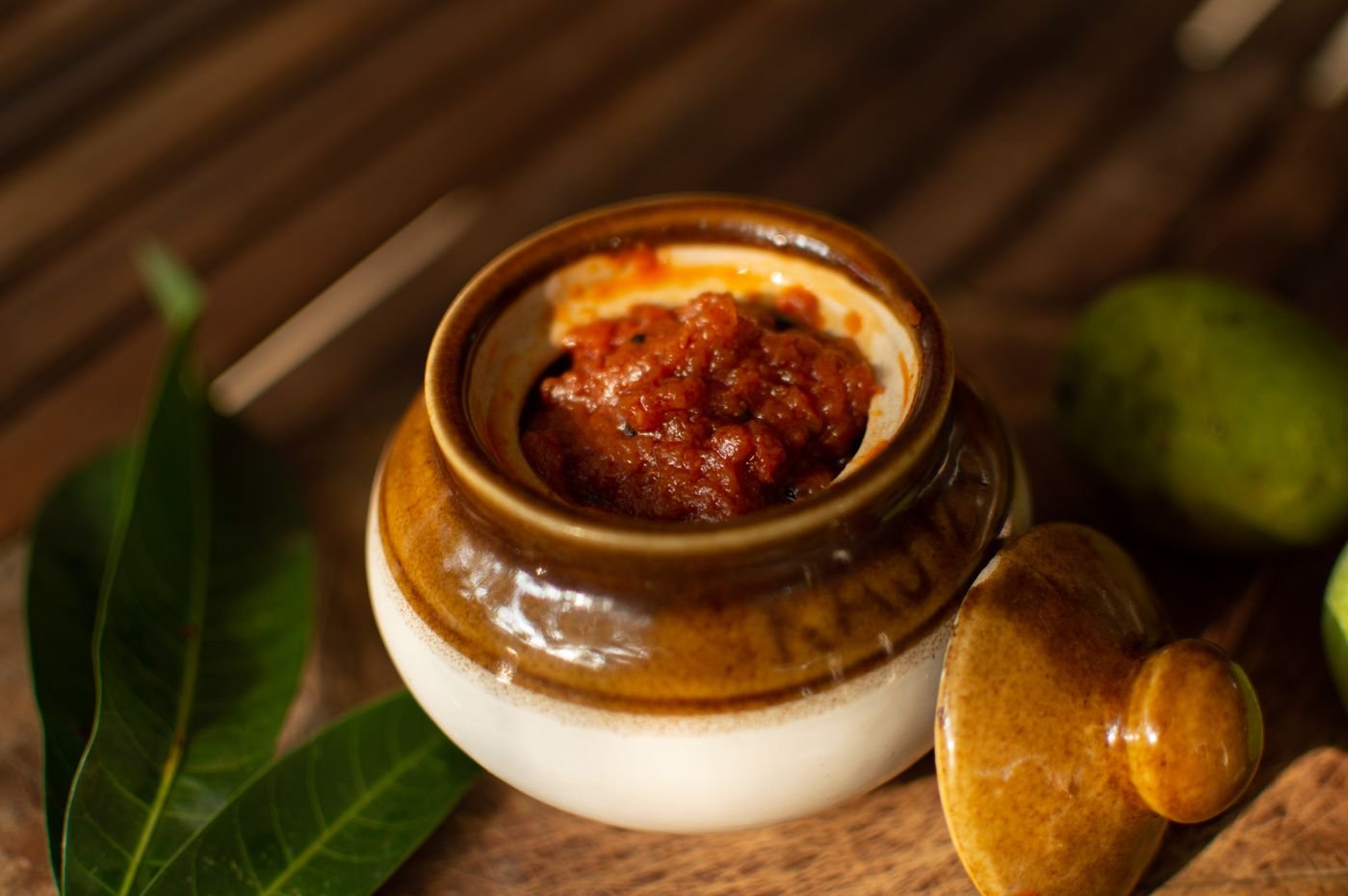 Mango pickle in a ceramic jar