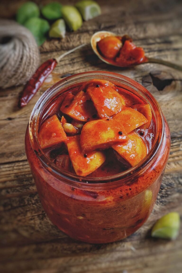 Homemade mango pickle in a glass jar